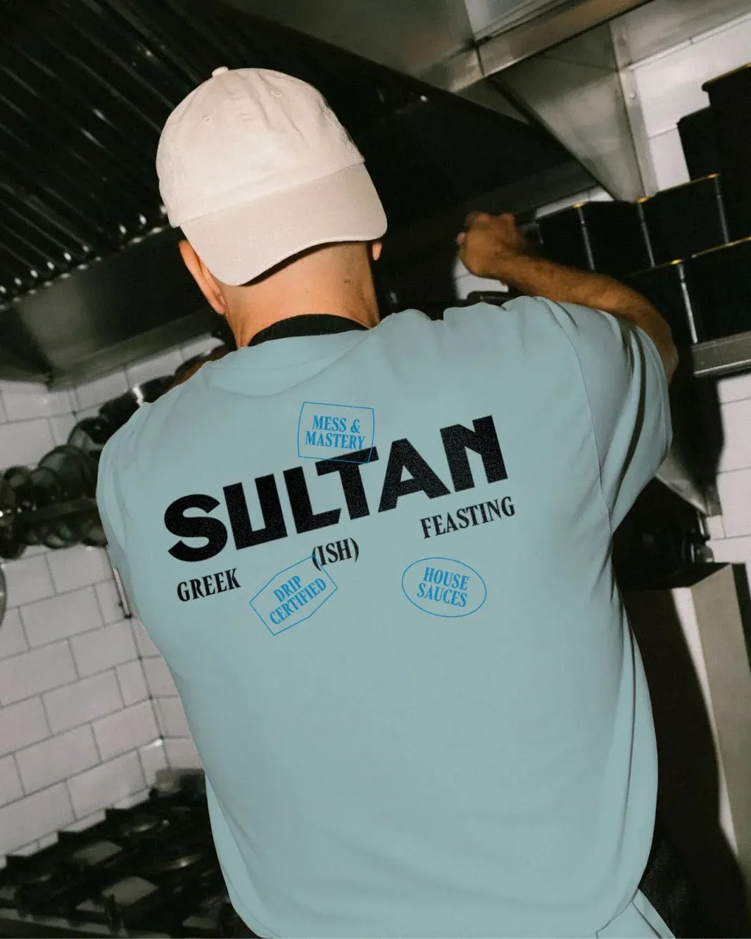 Sultan's Kitchen — staff tee with stickers