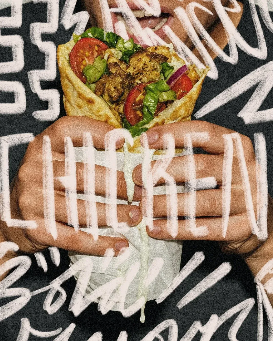 Sultan's Kitchen — hands holding a gyros